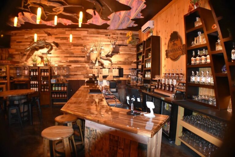 The bar and bottle shelves inside Homosassa Distillery & Brewing Co.
